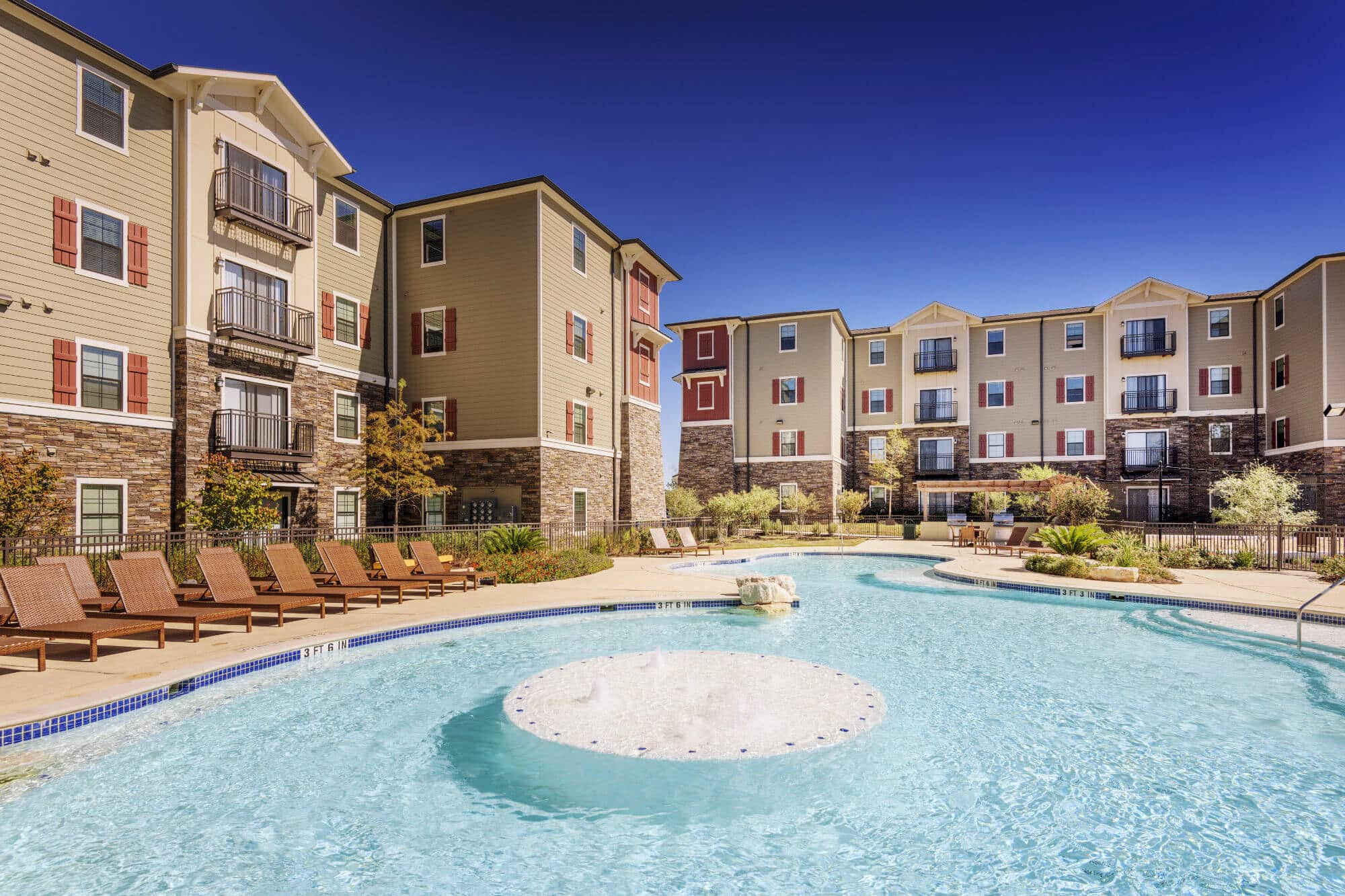 arba san marcos off campus apartments near texas state university california style pool lounging deck building exterior
